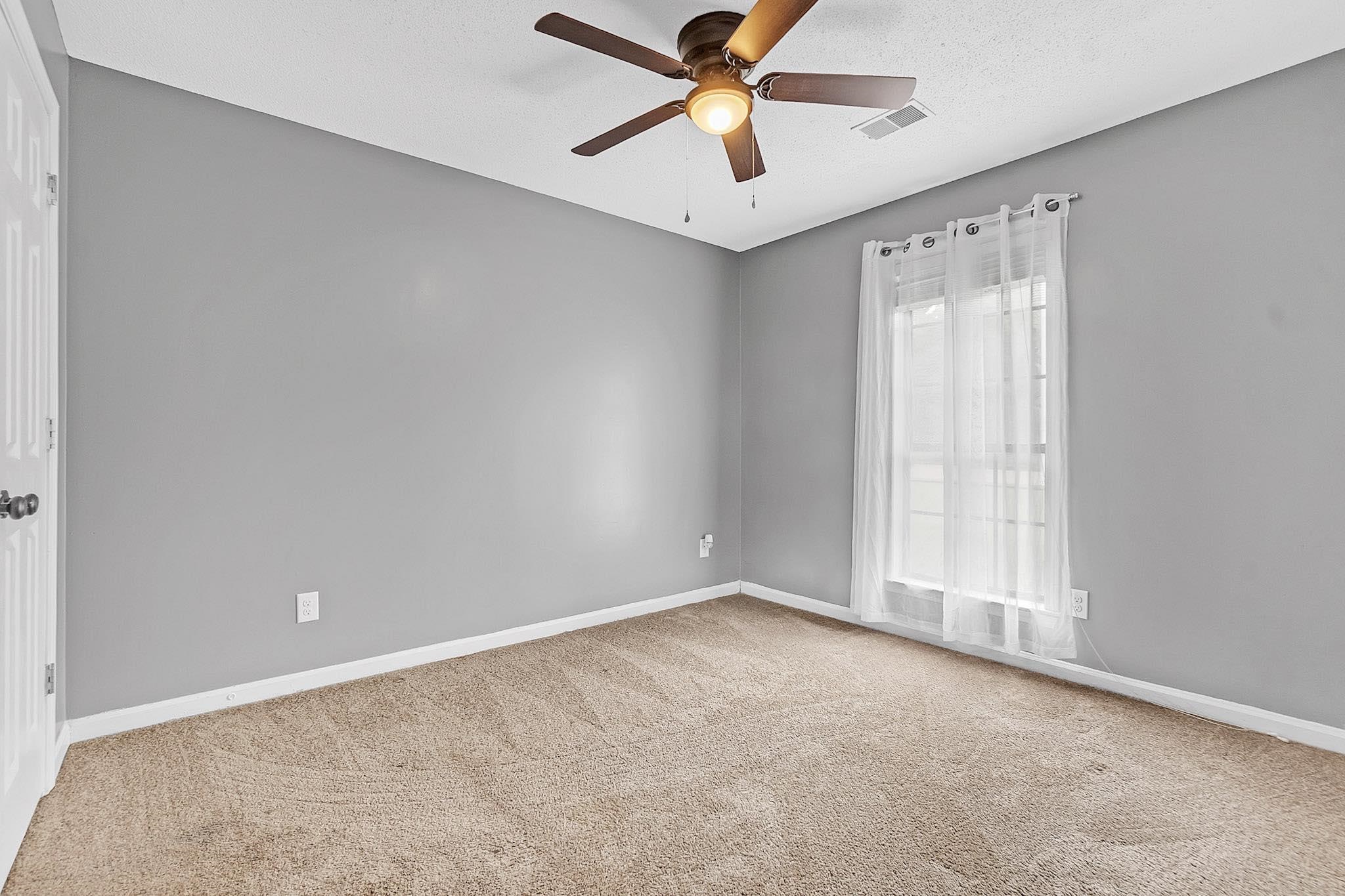 4788 Shadow View Lane Bartlett, TN 38002 - Photo 26 of 33 Carpeted spare room featuring a ceiling fan and baseboards