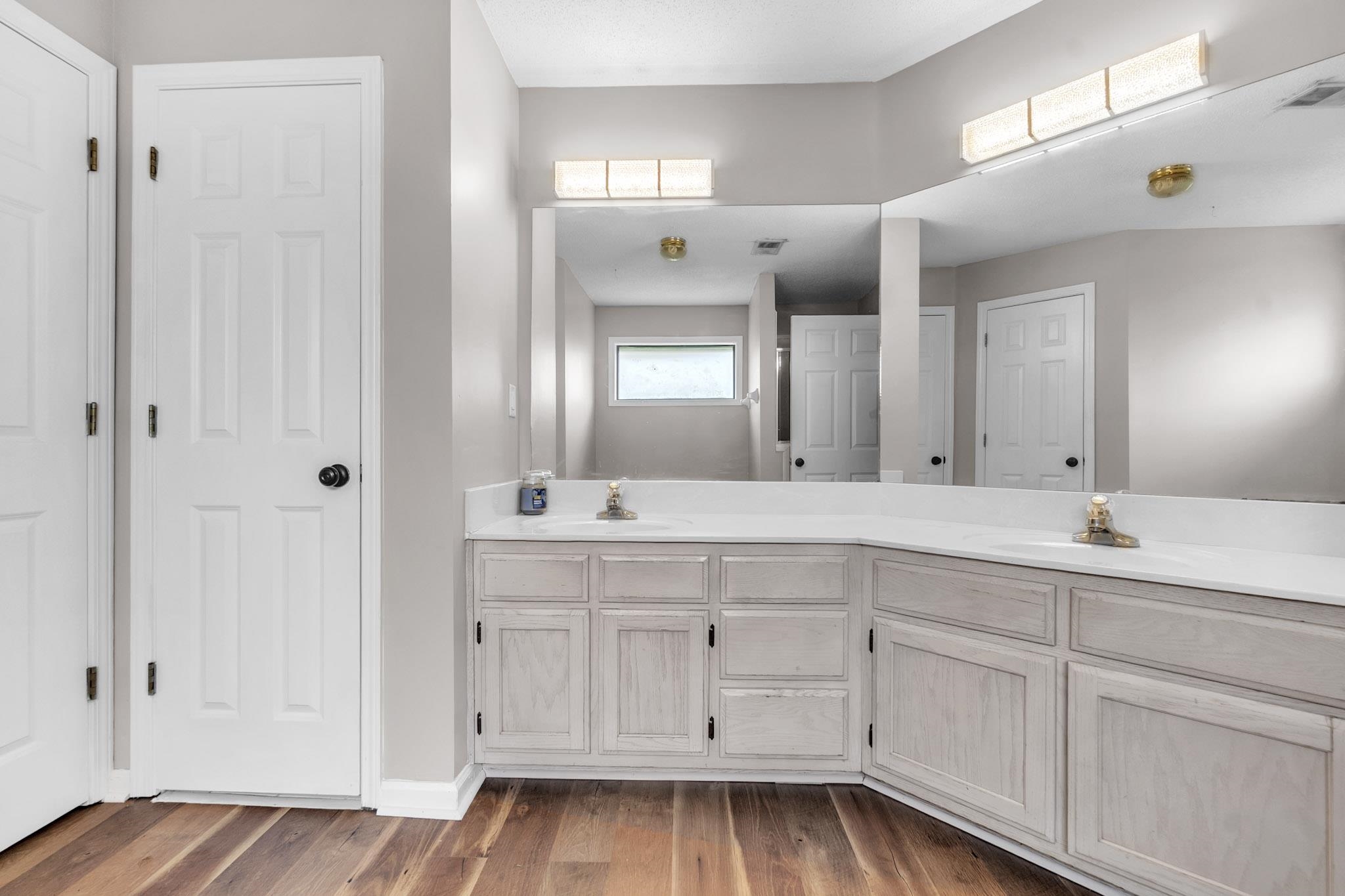 4788 Shadow View Lane Bartlett, TN 38002 - Photo 32 of 33 Full bath with double vanity and wood finished floors