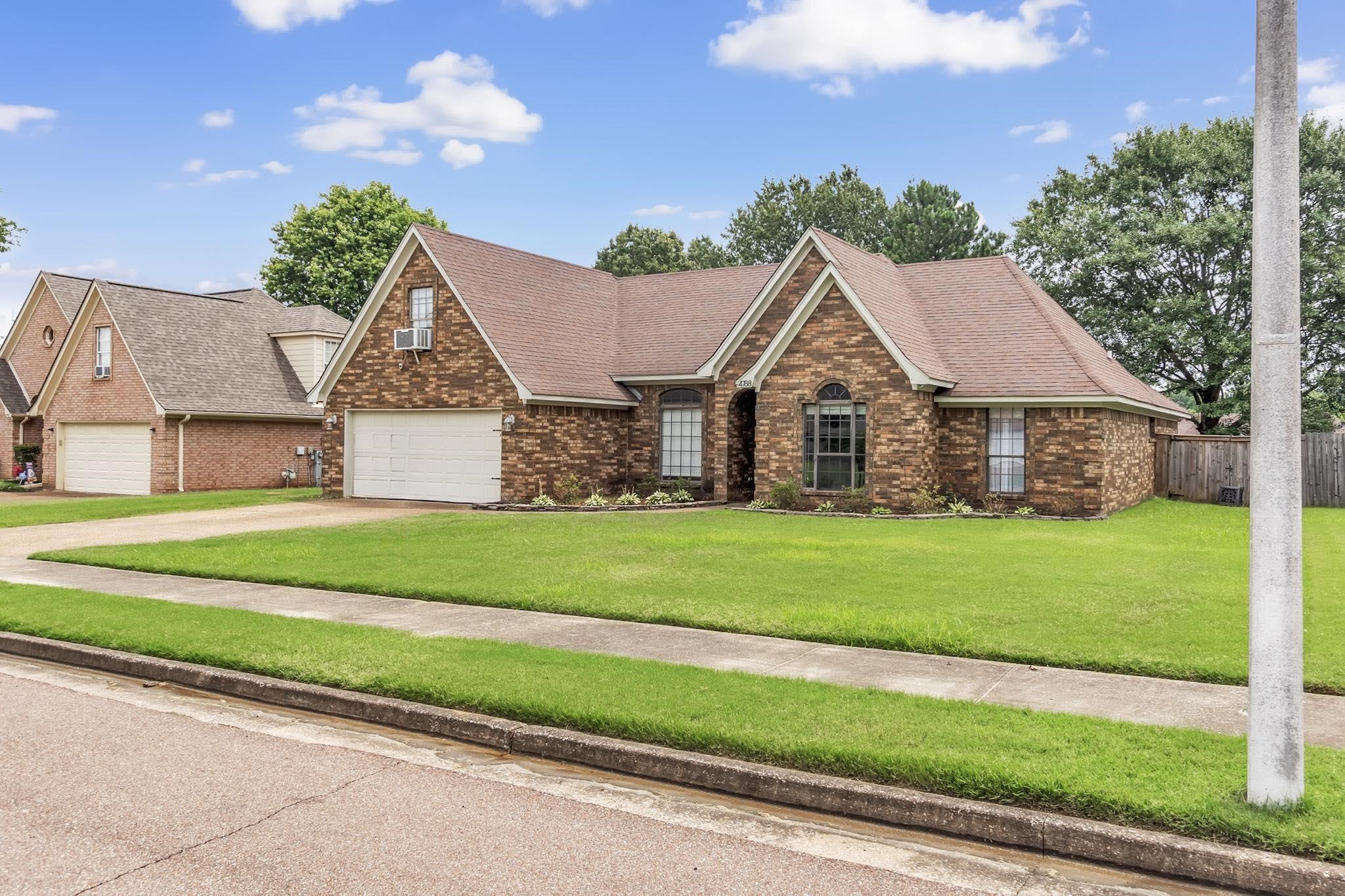 4788 Shadow View Lane Bartlett, TN 38002 - Photo 4 of 33 View of front facade featuring brick siding, driveway, and a shingled roof