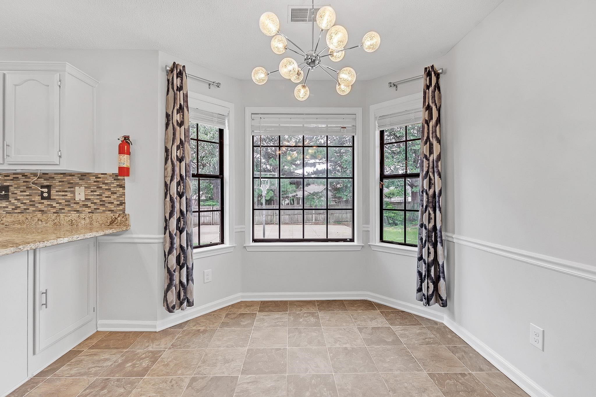 4788 Shadow View Lane Bartlett, TN 38002 - Photo 9 of 33 Unfurnished dining area featuring a chandelier and baseboards