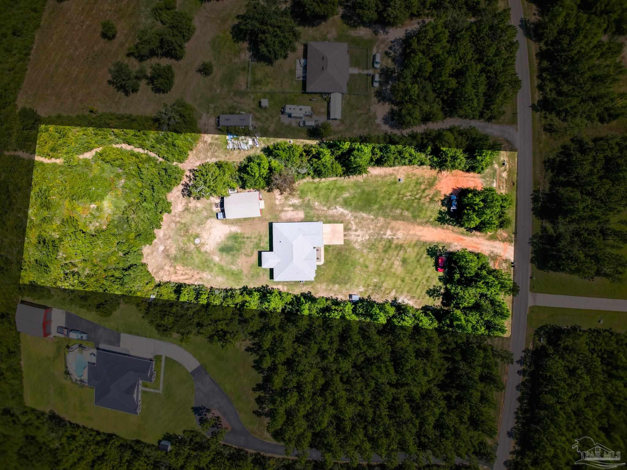 an aerial view of residential house with outdoor space