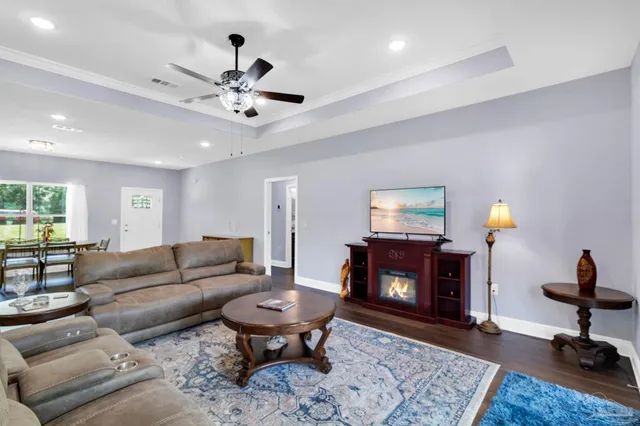 a kitchen with stainless steel appliances granite countertop a refrigerator a sink a stove a microwave and island