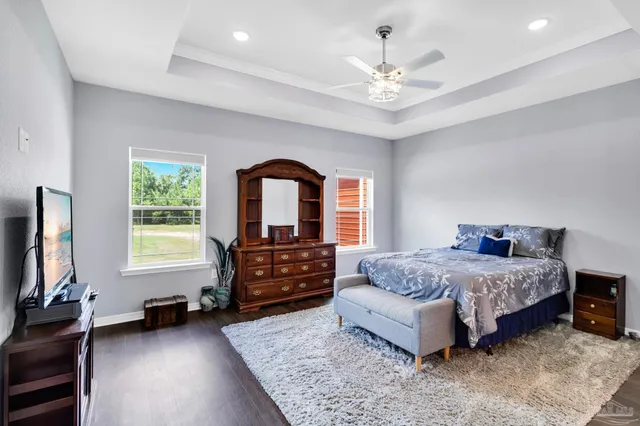a bathroom with a granite countertop sink a toilet and a mirror
