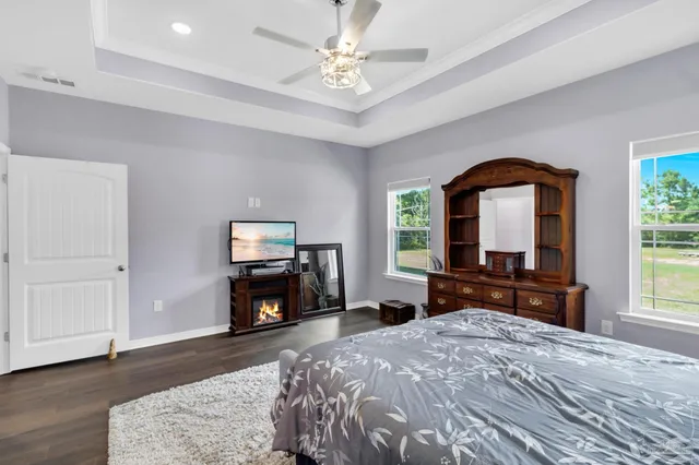 a bathroom with a double vanity sink mirror and shower