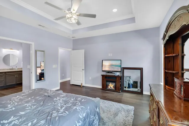 a bedroom with a bed and a dresser