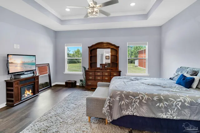 a bathroom with a granite countertop sink a toilet and a mirror