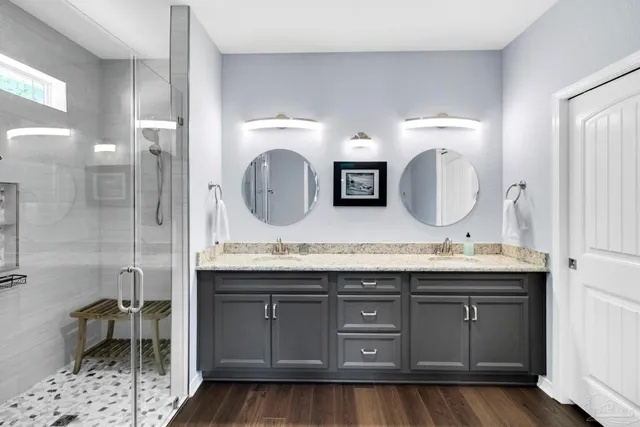 a bathroom with a shower and a bath tub