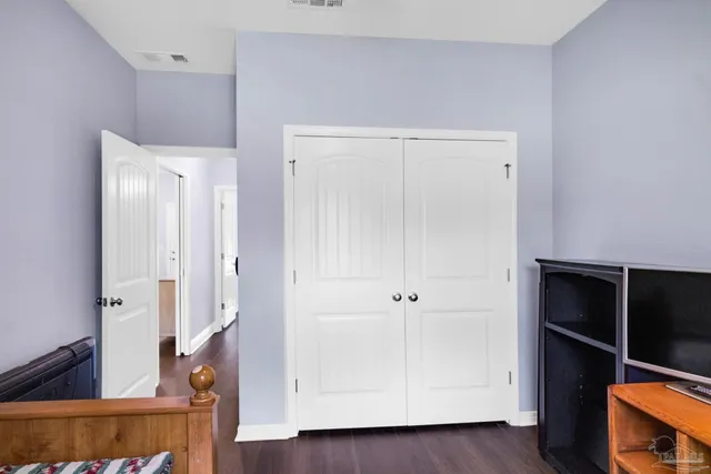 a view of a big yard with swimming pool and green space