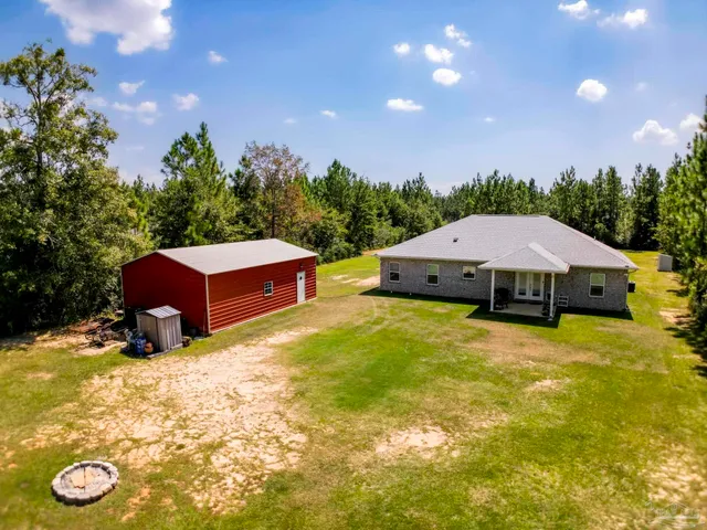 an aerial view of residential house with outdoor space
