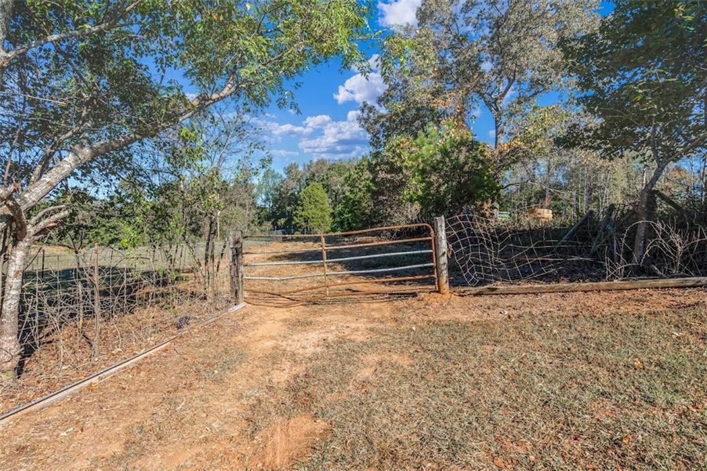 1075 Davis Road Carrollton, GA 30116 - Photo 11 of 23 a view of outdoor space with deck and tree