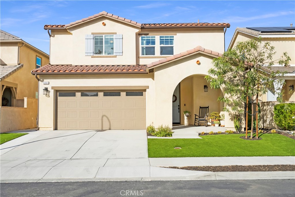 5337 Elsa Street Riverside, CA 92504 - Photo 1 of 1 a front view of a house with a garden