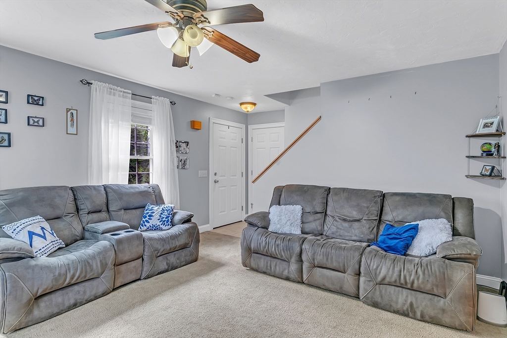 185 Bemis Road Warren, MA 01585 - Photo 12 of 36 a living room with furniture and a ceiling fan