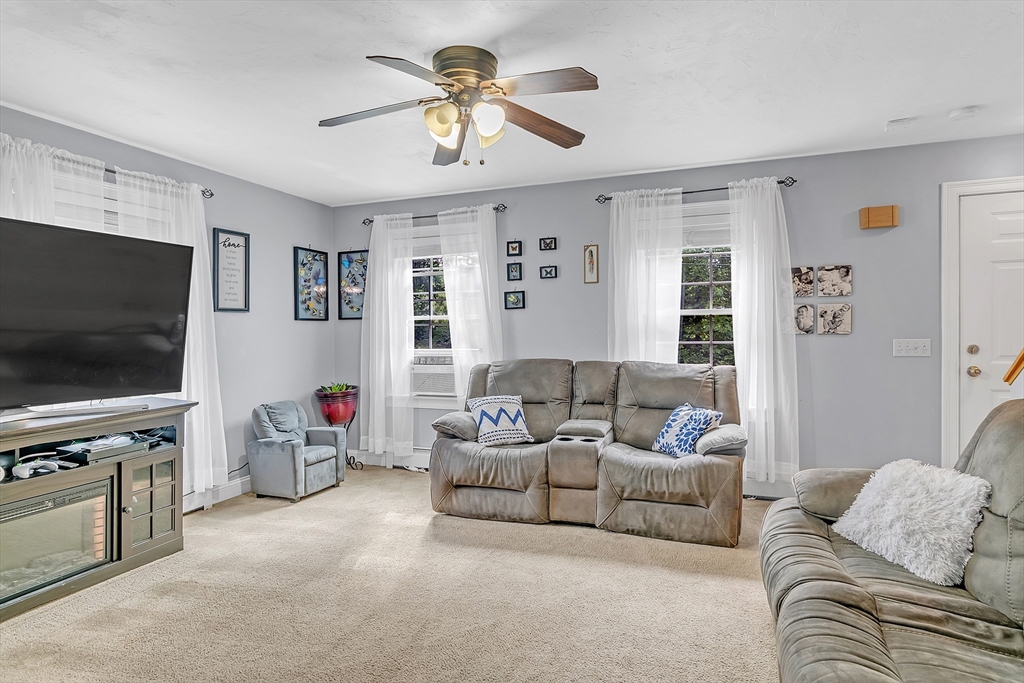 185 Bemis Road Warren, MA 01585 - Photo 13 of 36 a living room with furniture and a flat screen tv