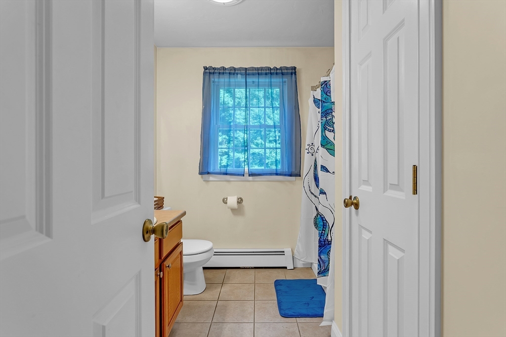 185 Bemis Road Warren, MA 01585 - Photo 14 of 36 a bathroom with a tub and a shower
