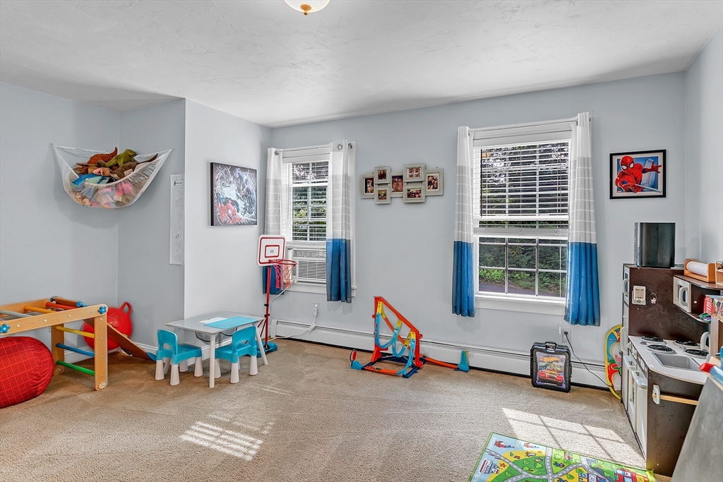 185 Bemis Road Warren, MA 01585 - Photo 16 of 36 a living room with furniture a flat screen tv and a window