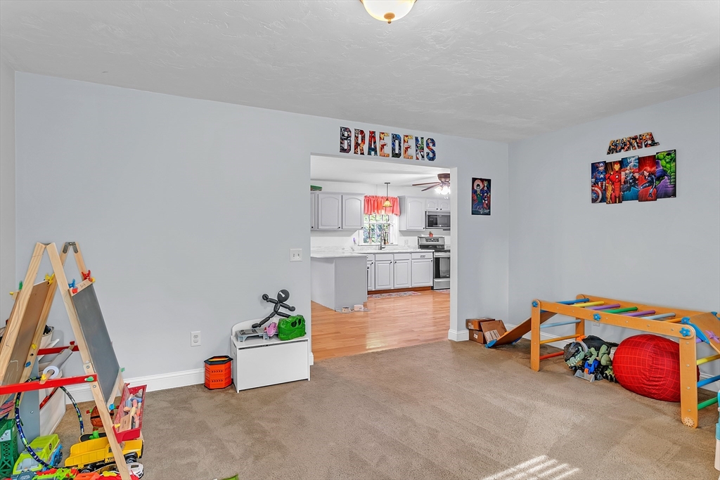 185 Bemis Road Warren, MA 01585 - Photo 17 of 36 a room with toys and a couch