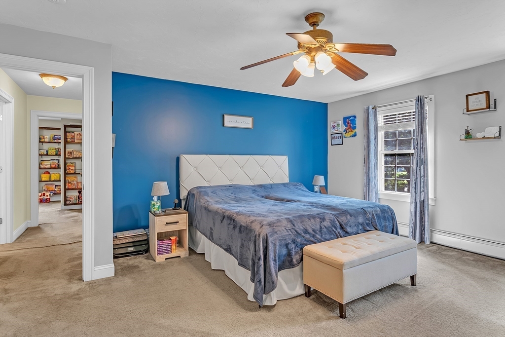 185 Bemis Road Warren, MA 01585 - Photo 18 of 36 a bedroom with a bed and a ceiling fan