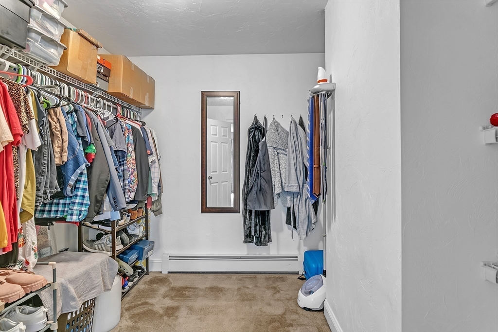185 Bemis Road Warren, MA 01585 - Photo 19 of 36 a view of walk in closet with clothes