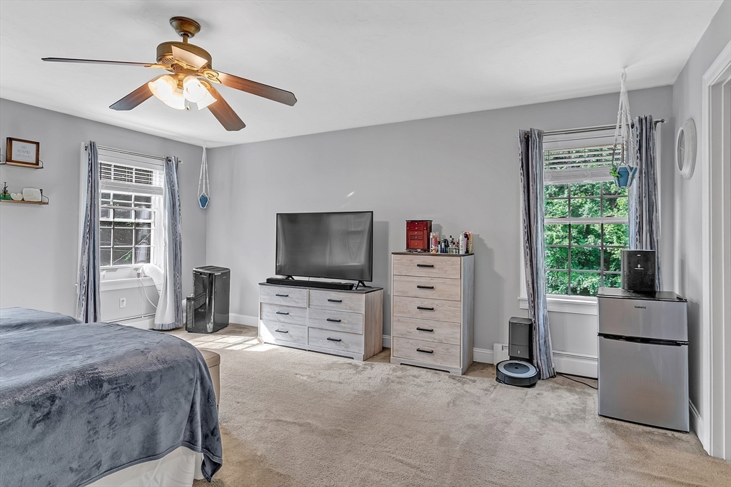 185 Bemis Road Warren, MA 01585 - Photo 20 of 36 a bedroom with furniture and a flat screen tv