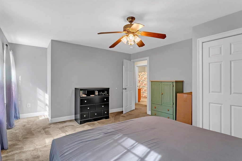 185 Bemis Road Warren, MA 01585 - Photo 22 of 36 a living room with furniture and a ceiling fan