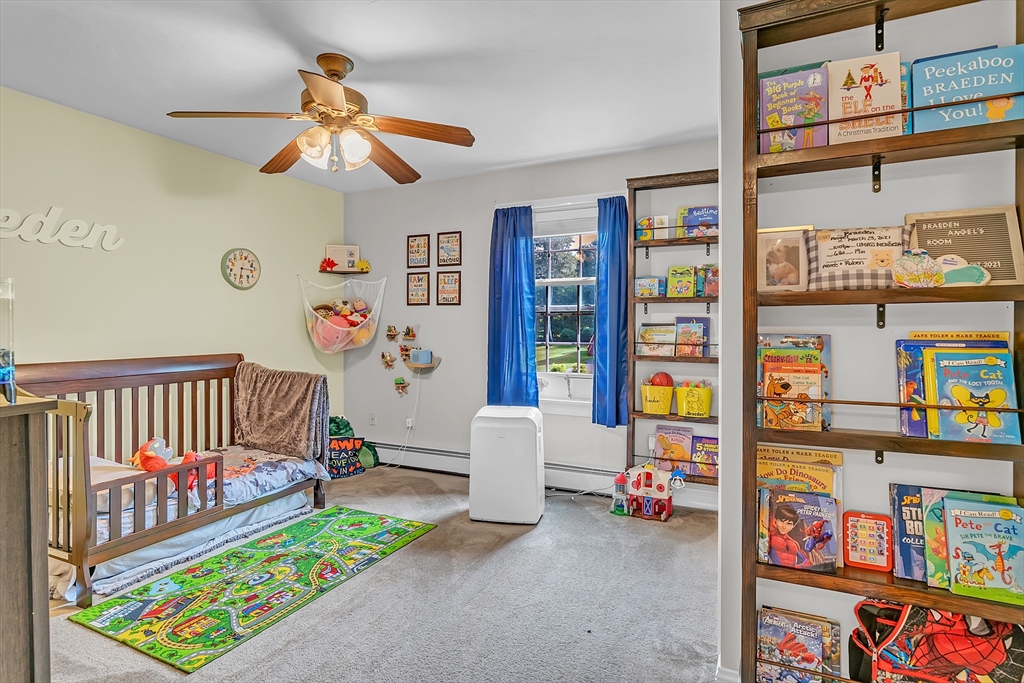 185 Bemis Road Warren, MA 01585 - Photo 23 of 36 a bedroom with furniture and a book shelf