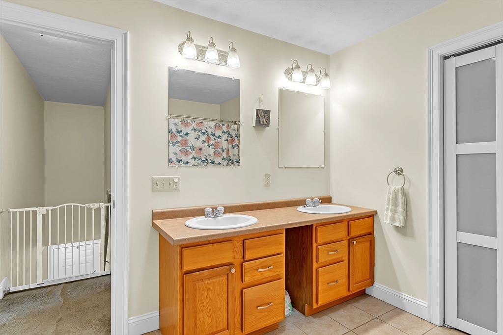 185 Bemis Road Warren, MA 01585 - Photo 26 of 36 a bathroom with a sink vanity and a mirror