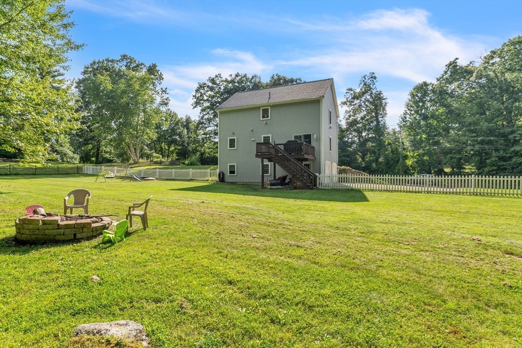 185 Bemis Road Warren, MA 01585 - Photo 32 of 36 a view of a swimming pool with lawn chairs and plants