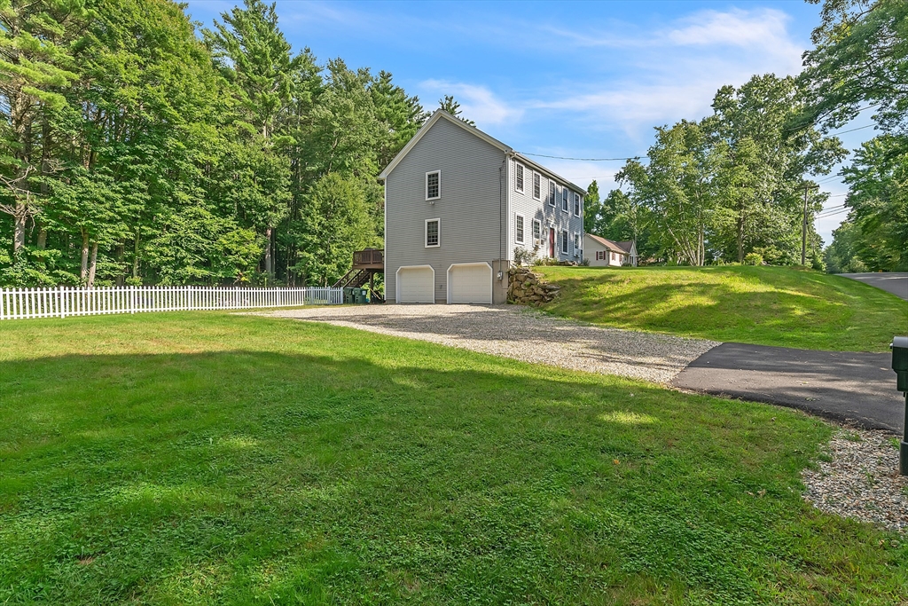 185 Bemis Road Warren, MA 01585 - Photo 36 of 36 a front view of a house with a yard and trees