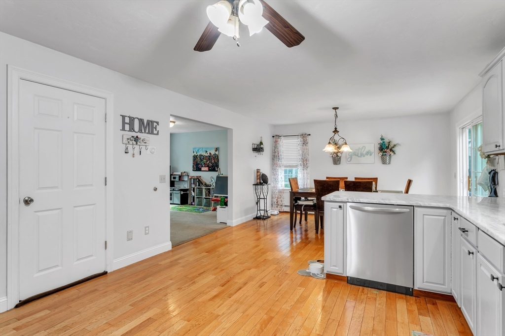 185 Bemis Road Warren, MA 01585 - Photo 6 of 36 a kitchen with a sink cabinets and wooden floor