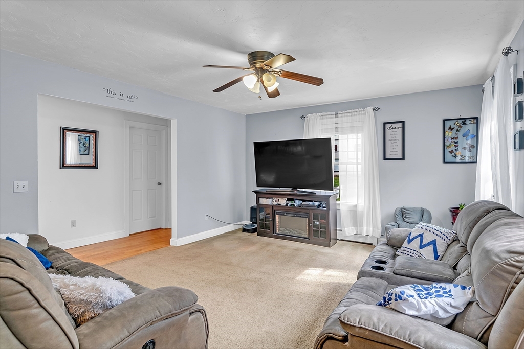 185 Bemis Road Warren, MA 01585 - Photo 10 of 36 a living room with furniture and a flat screen tv