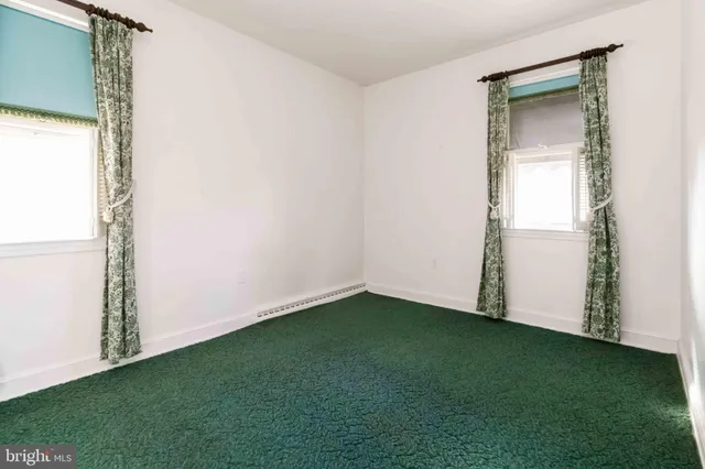 a view of empty room with closet