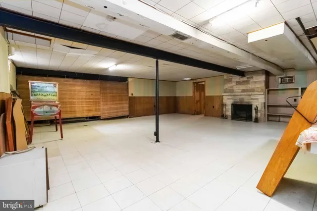 a view of an empty room with a fireplace