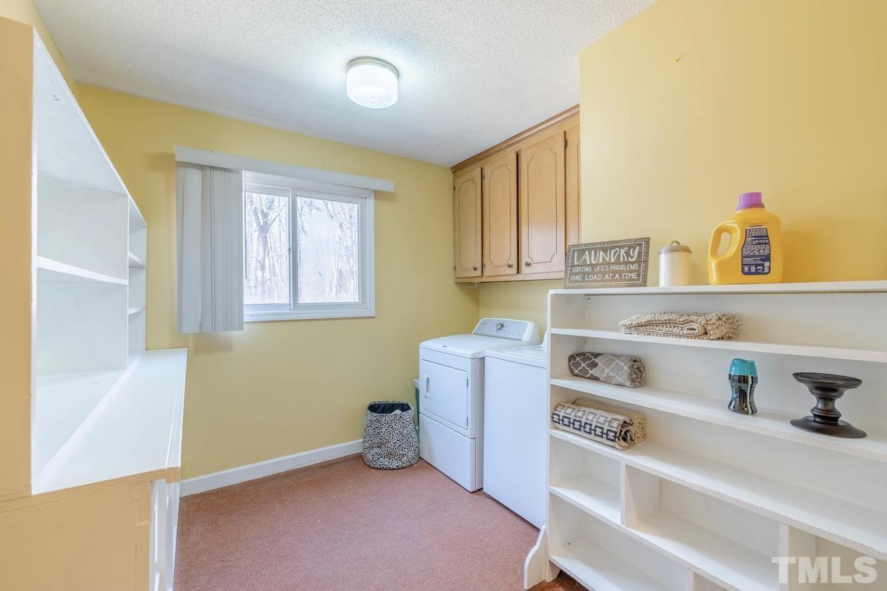 8200 McKee Road Rougemont, NC 27572 - Photo 29 of 32 a room with cabinets and window