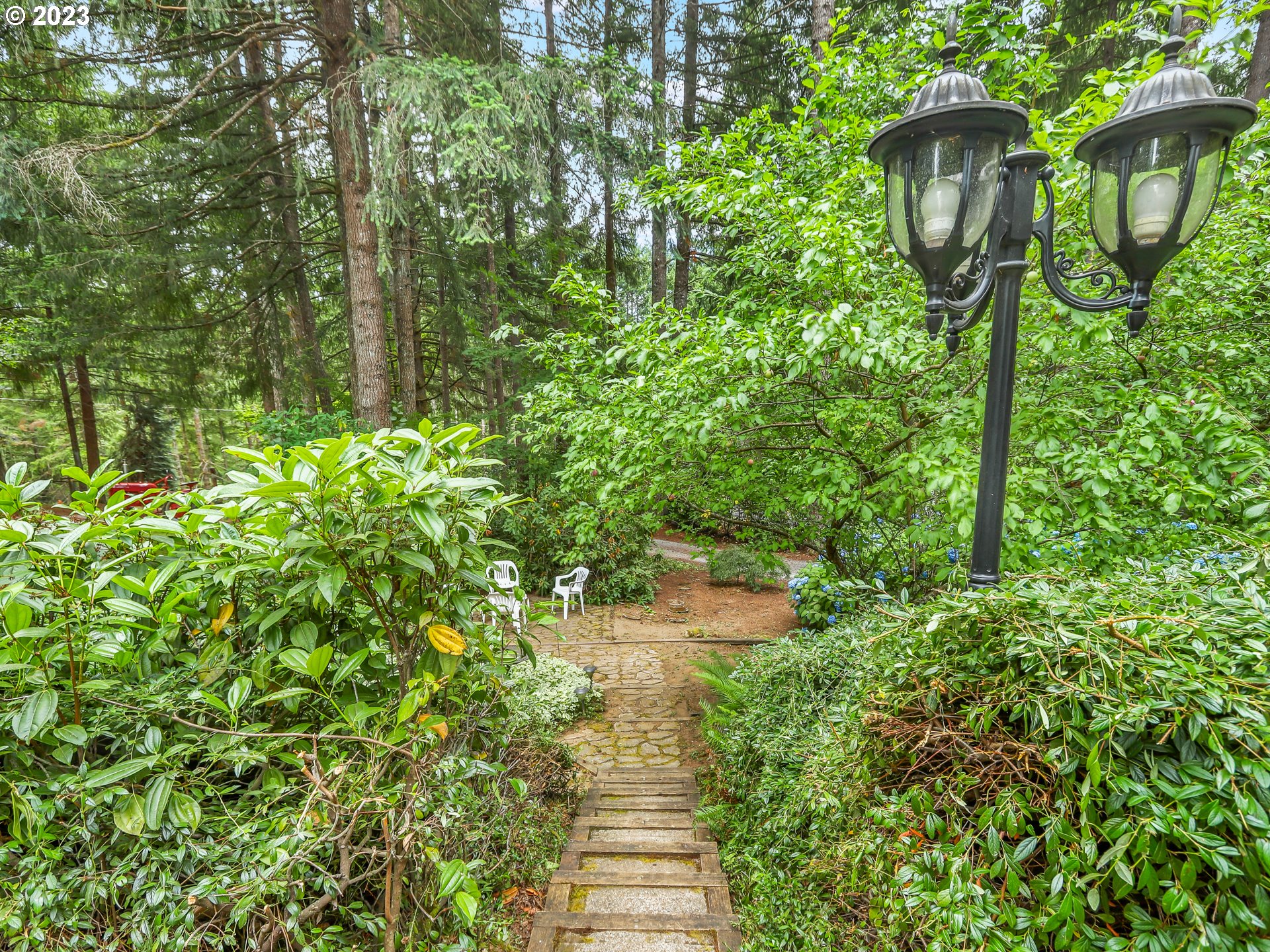 25875 South Morgan Road Estacada, OR 97023 - Photo 28 of 36 a backyard of a house with lots of green space and fountain in the back