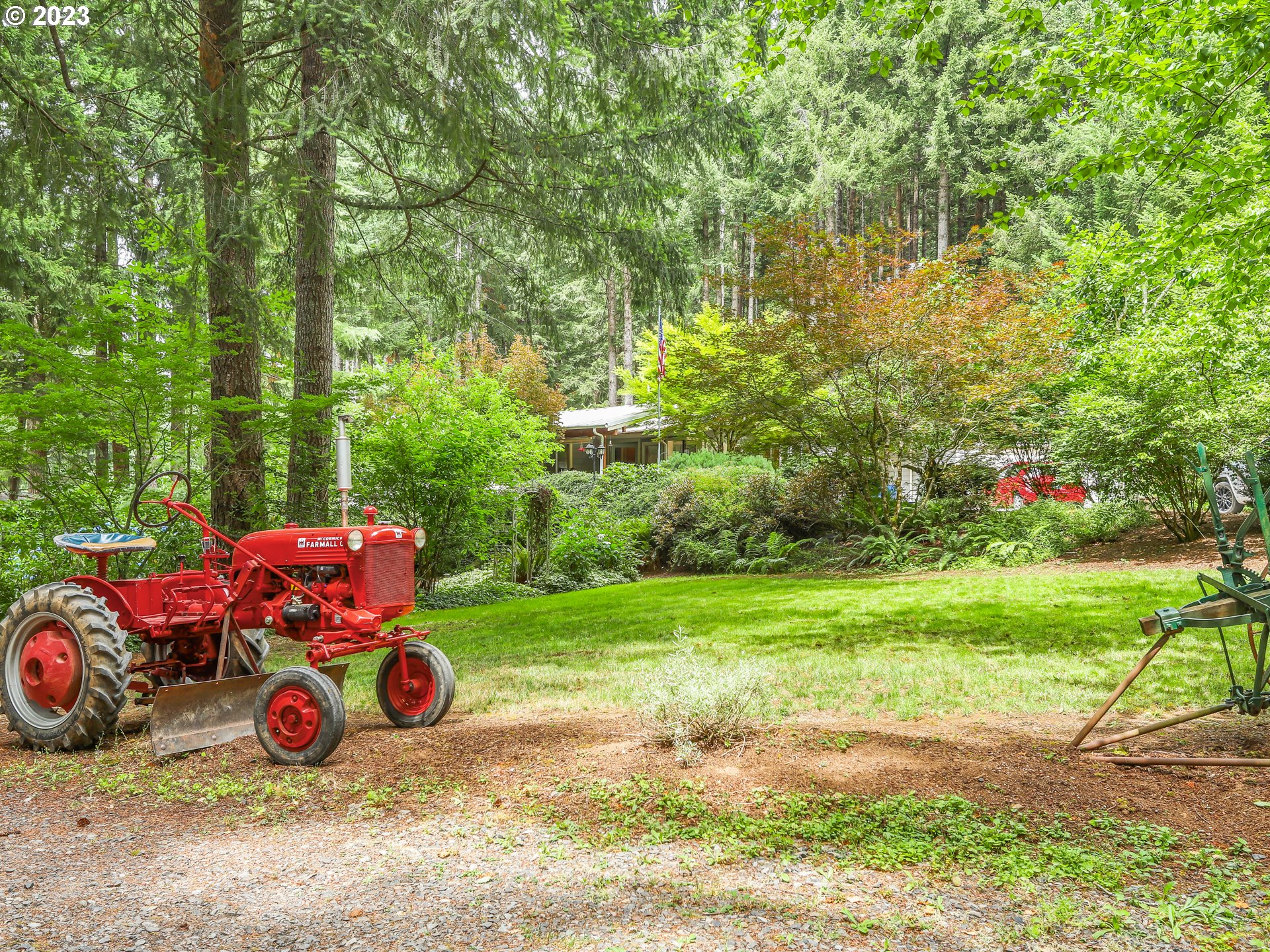 25875 South Morgan Road Estacada, OR 97023 - Photo 4 of 36 a view of a backyard with large trees and plants