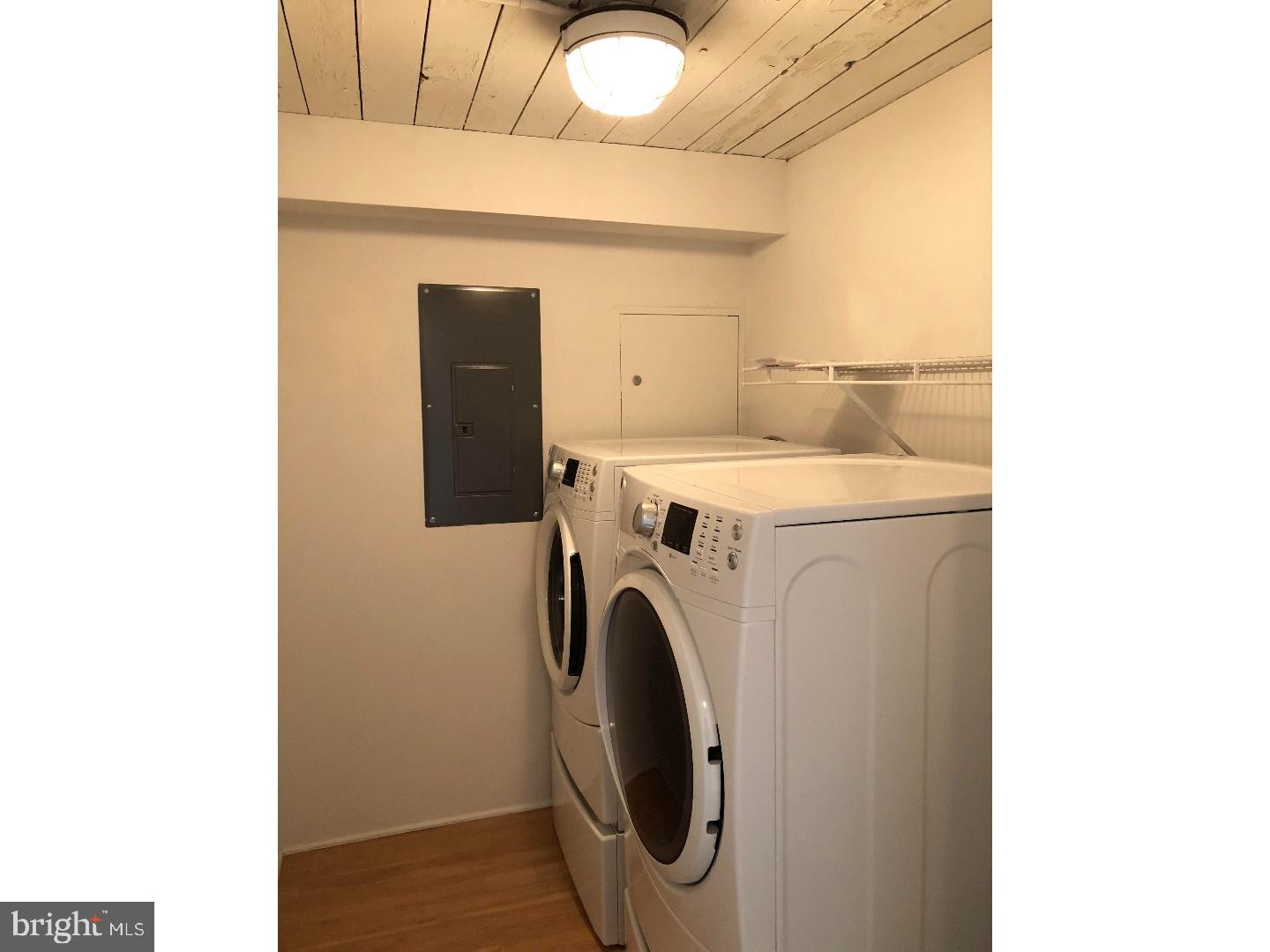 2300 Walnut Street, Unit 0B722 Philadelphia, PA 19103 - Photo 7 of 11 a utility room with dryer and washer