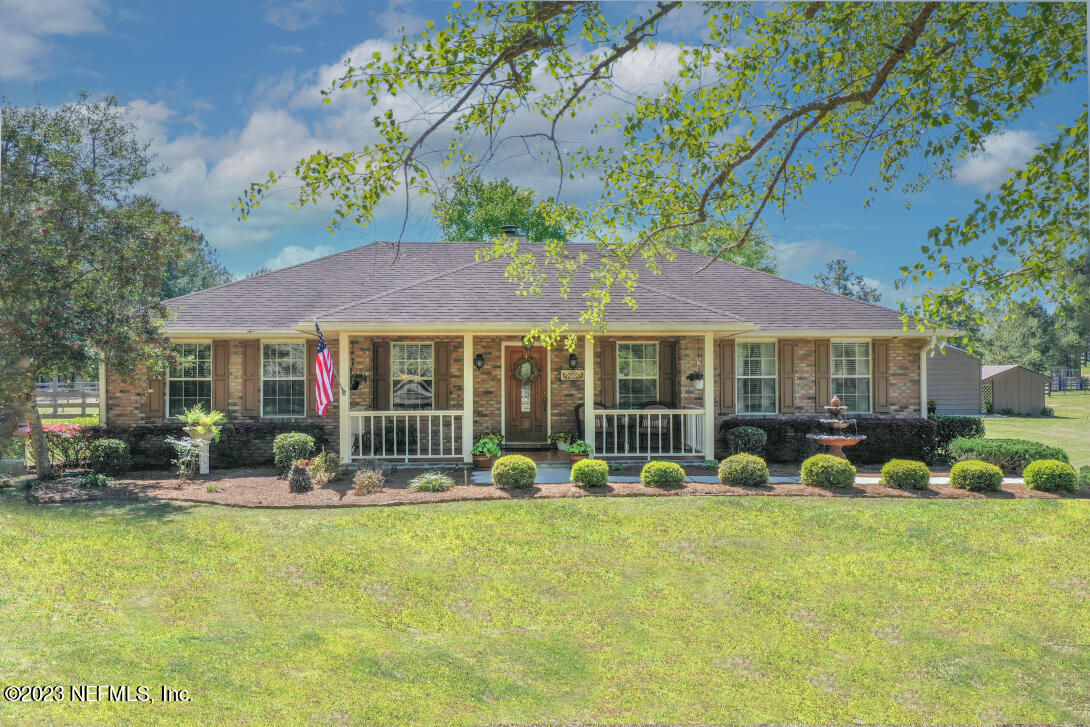 37491 Poole Road Hilliard, FL 32046 - Photo 1 of 39 a front view of house with yard and outdoor seating