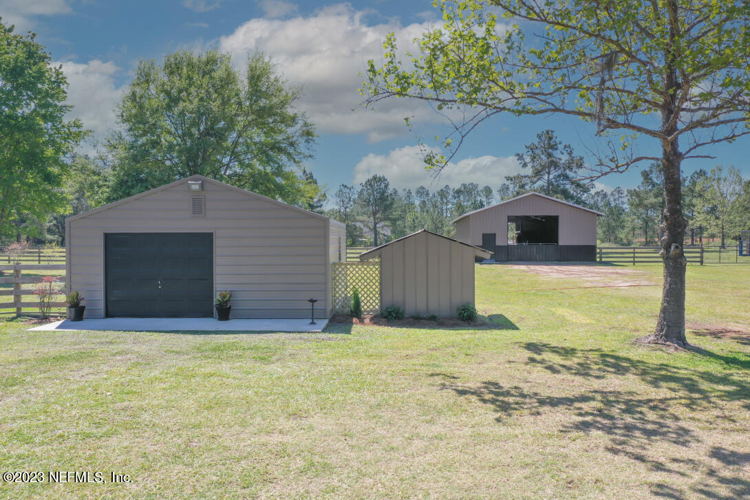 37491 Poole Road Hilliard, FL 32046 - Photo 12 of 39 a view of a house with a yard