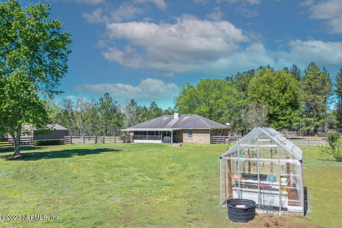 37491 Poole Road Hilliard, FL 32046 - Photo 15 of 39 a front view of a house with garden