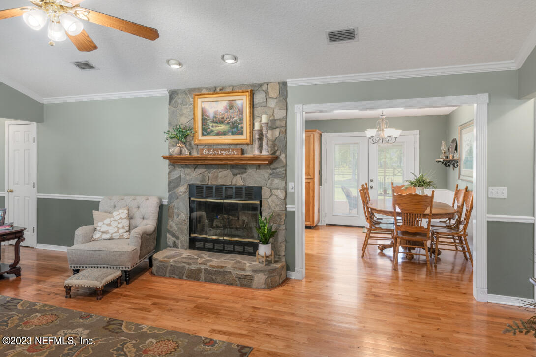 37491 Poole Road Hilliard, FL 32046 - Photo 19 of 39 a living room with furniture and a fireplace