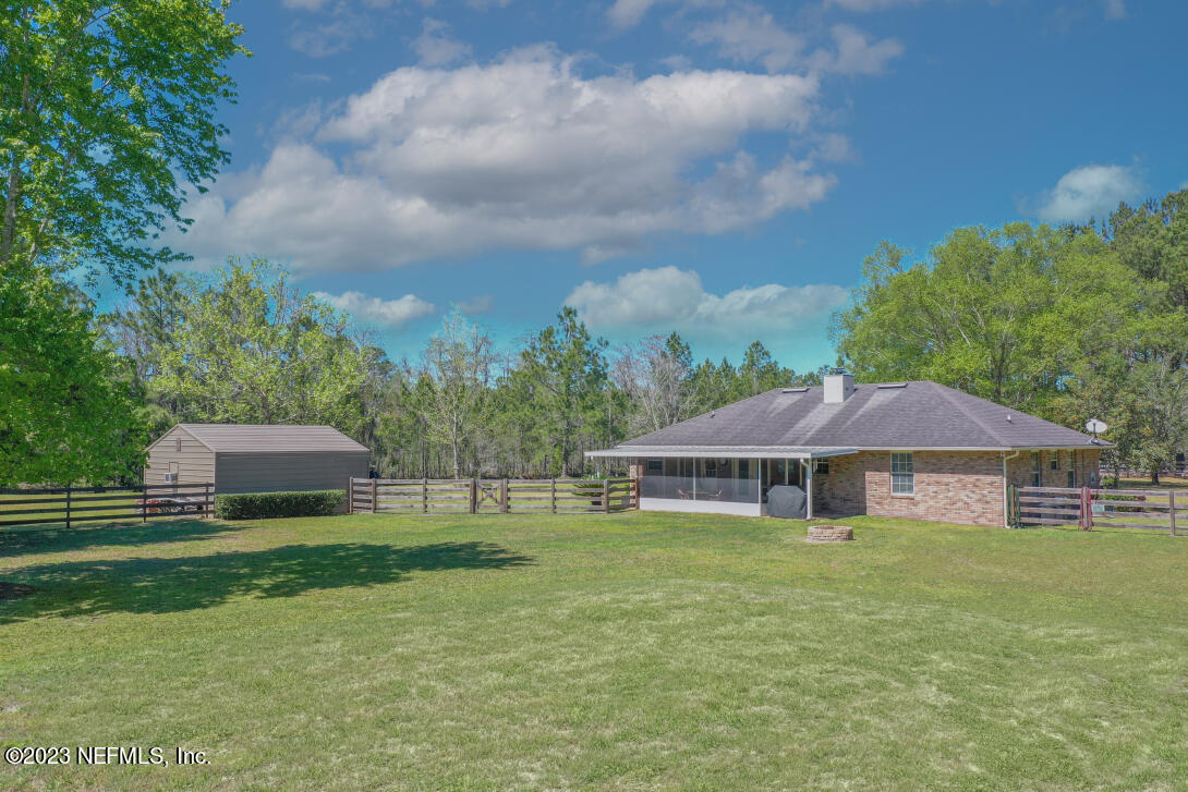 37491 Poole Road Hilliard, FL 32046 - Photo 2 of 39 a view of a house with a yard