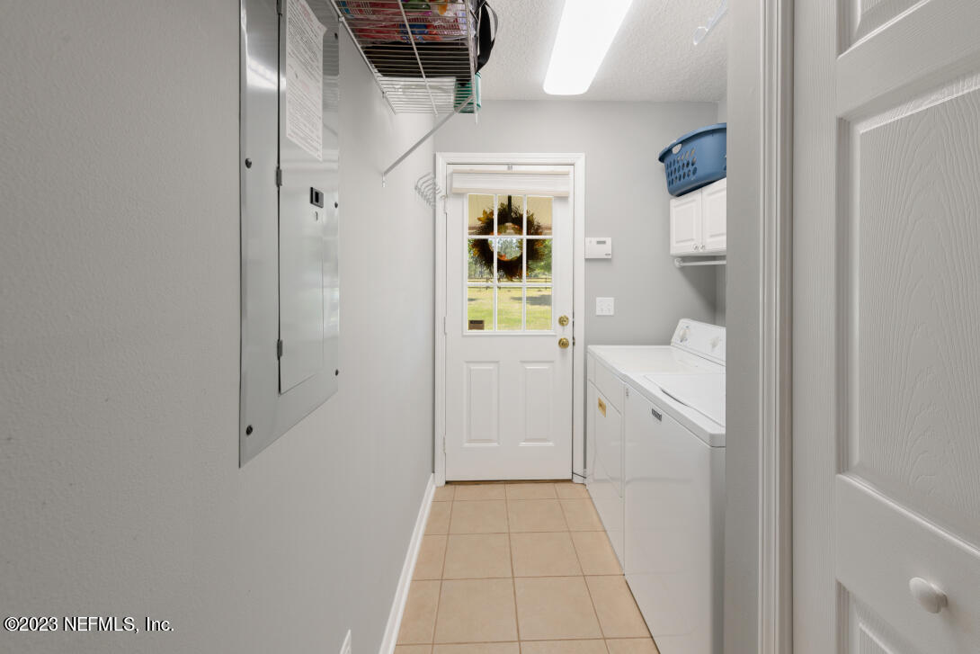 37491 Poole Road Hilliard, FL 32046 - Photo 36 of 39 a bathroom with a sink and mirror