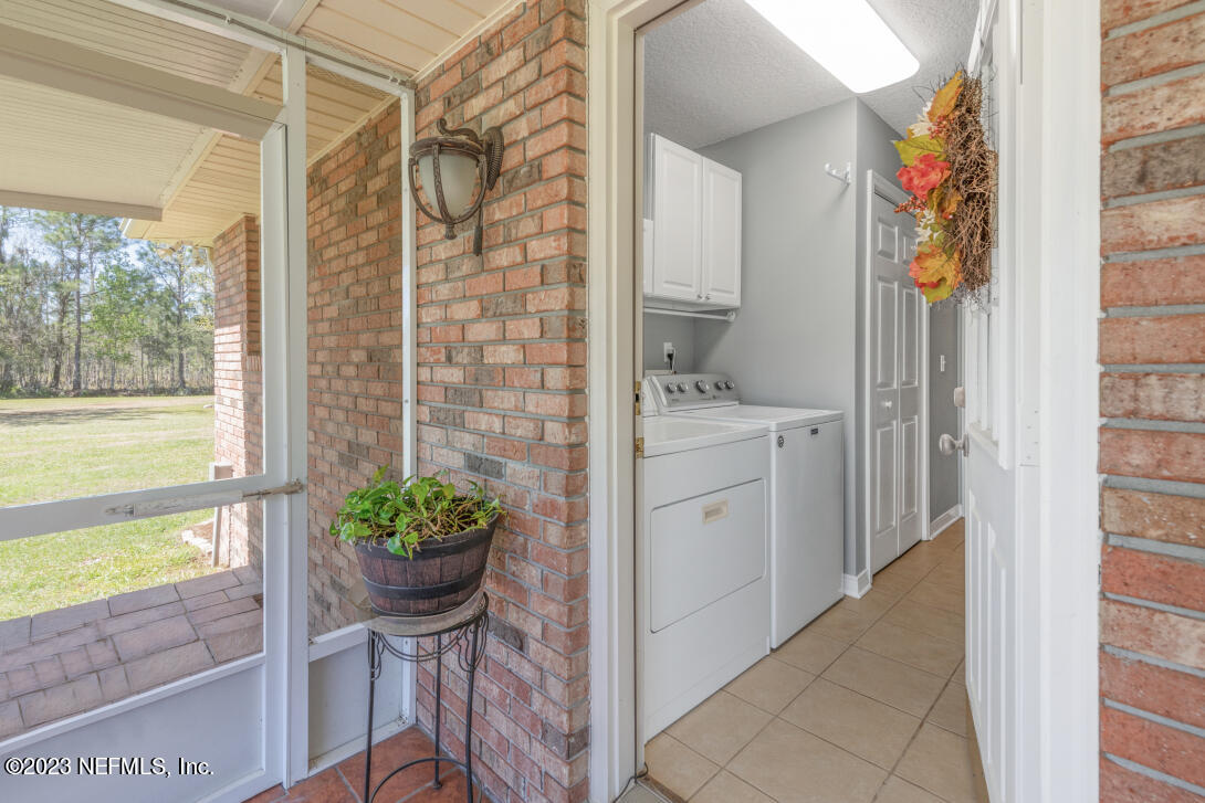 37491 Poole Road Hilliard, FL 32046 - Photo 37 of 39 a view of a entryway with furniture and floor to ceiling window