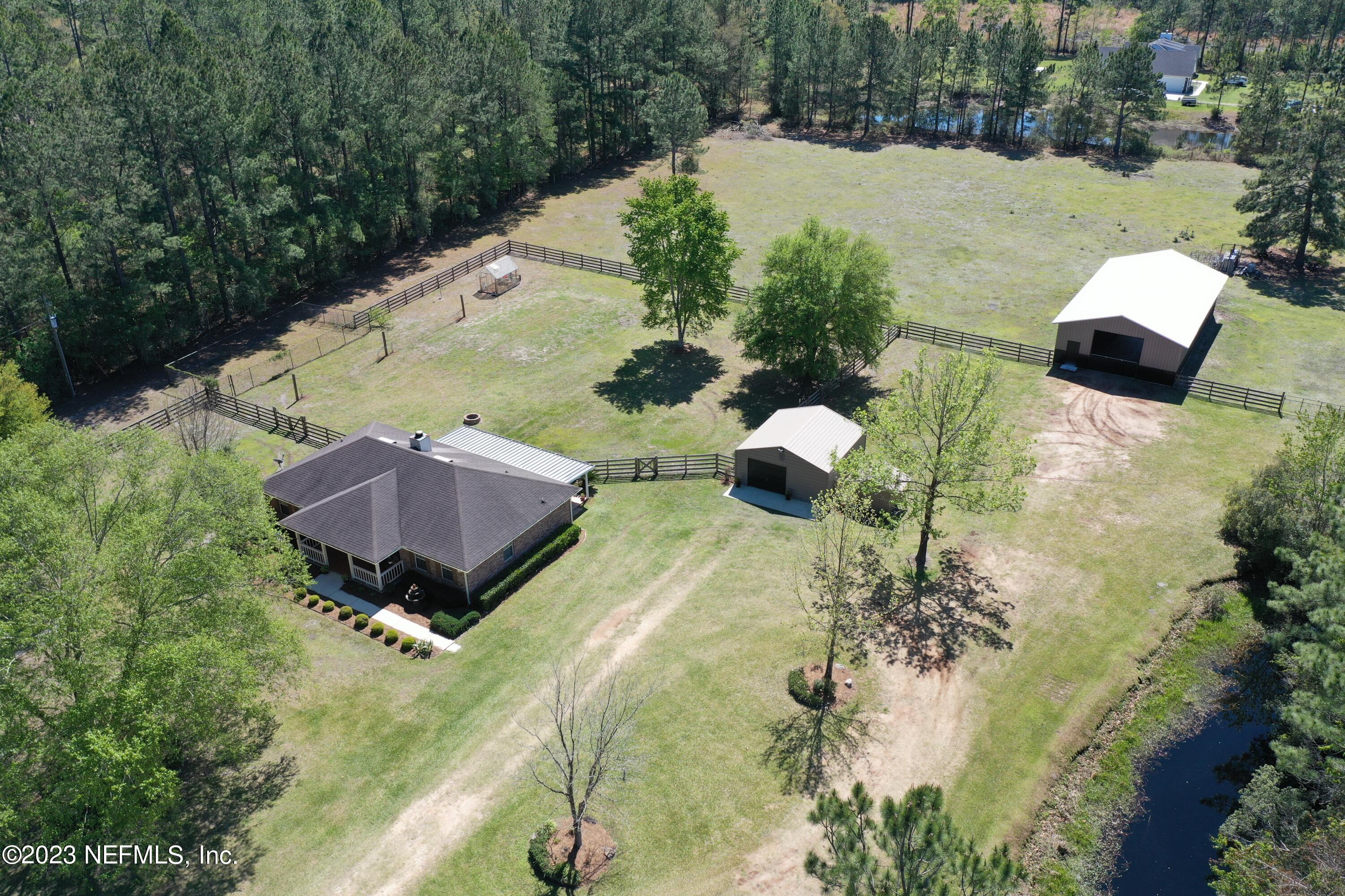 37491 Poole Road Hilliard, FL 32046 - Photo 38 of 39 a view of swimming pool with a yard