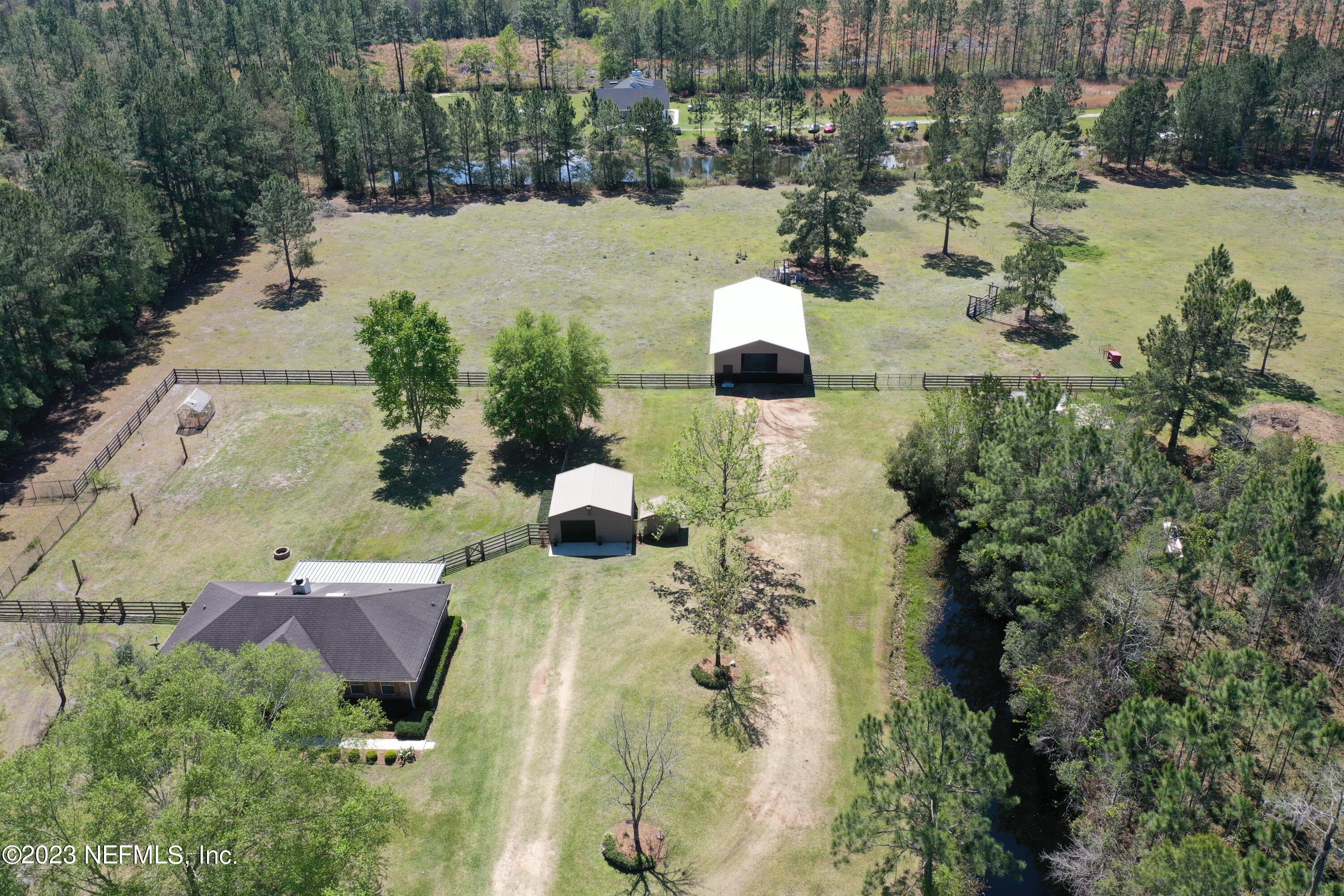 37491 Poole Road Hilliard, FL 32046 - Photo 39 of 39 an aerial view of residential houses with outdoor space