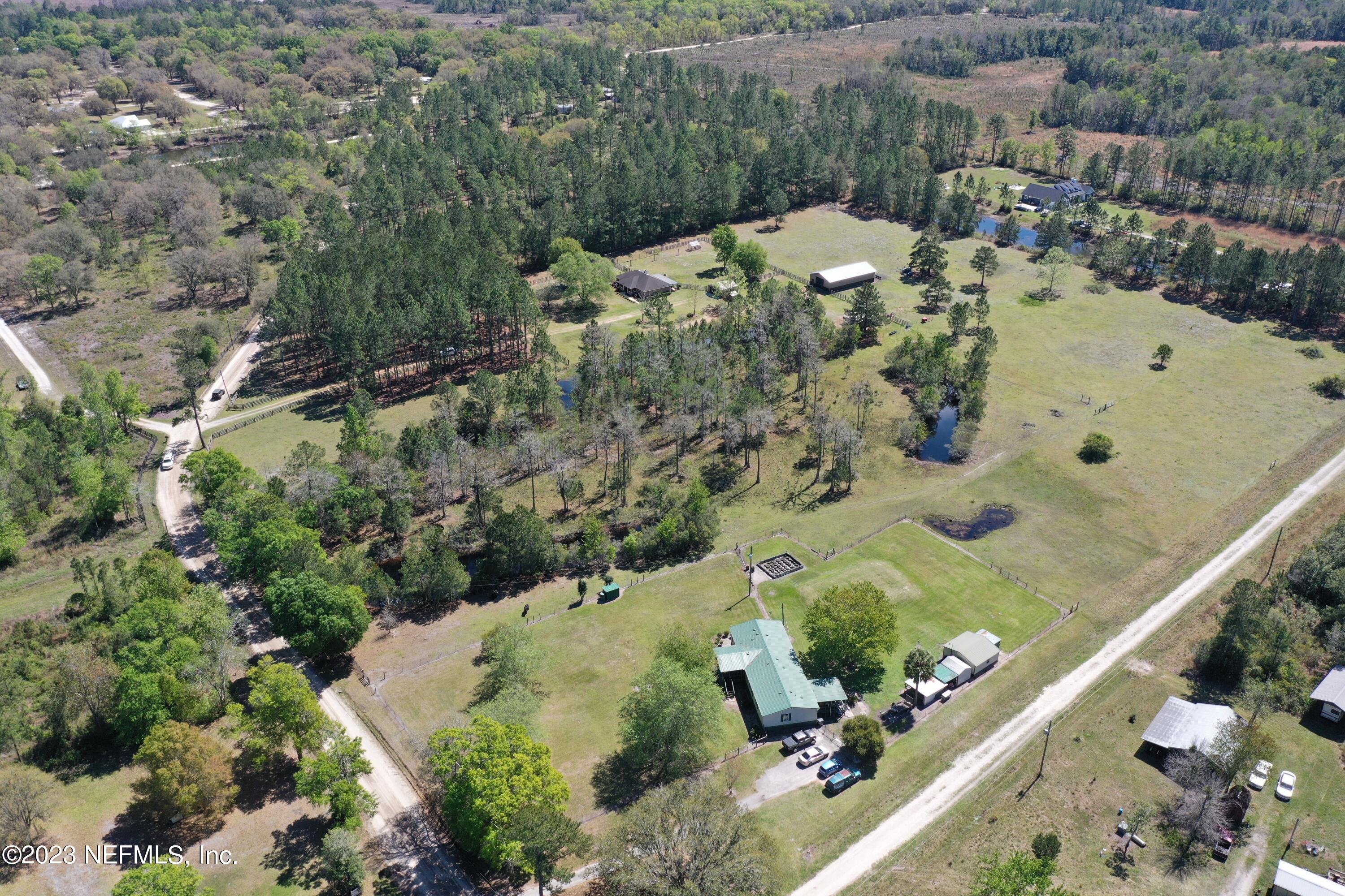 37491 Poole Road Hilliard, FL 32046 - Photo 5 of 39 an aerial view of a house with a yard
