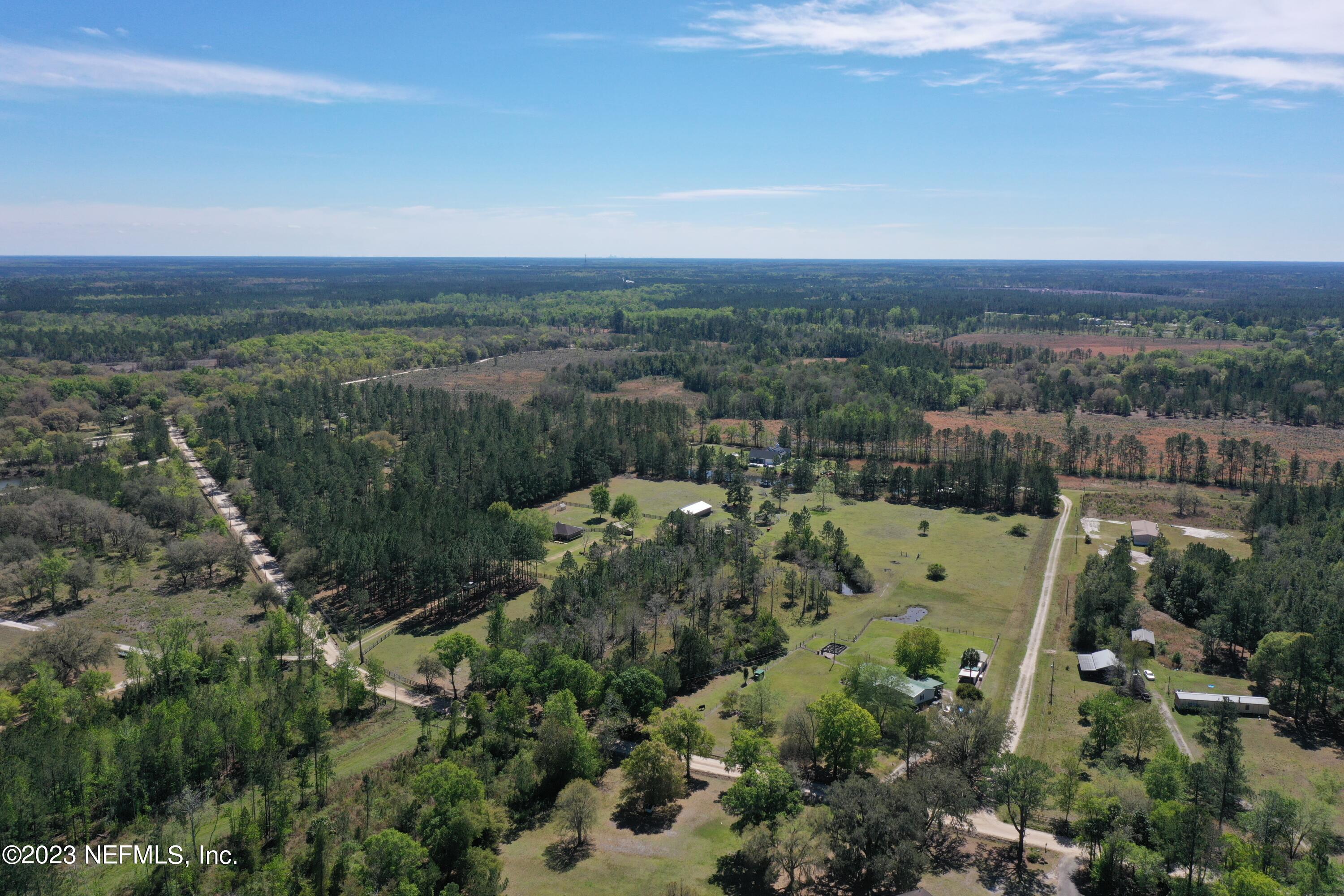 37491 Poole Road Hilliard, FL 32046 - Photo 8 of 39 an aerial view of residential house and outdoor space