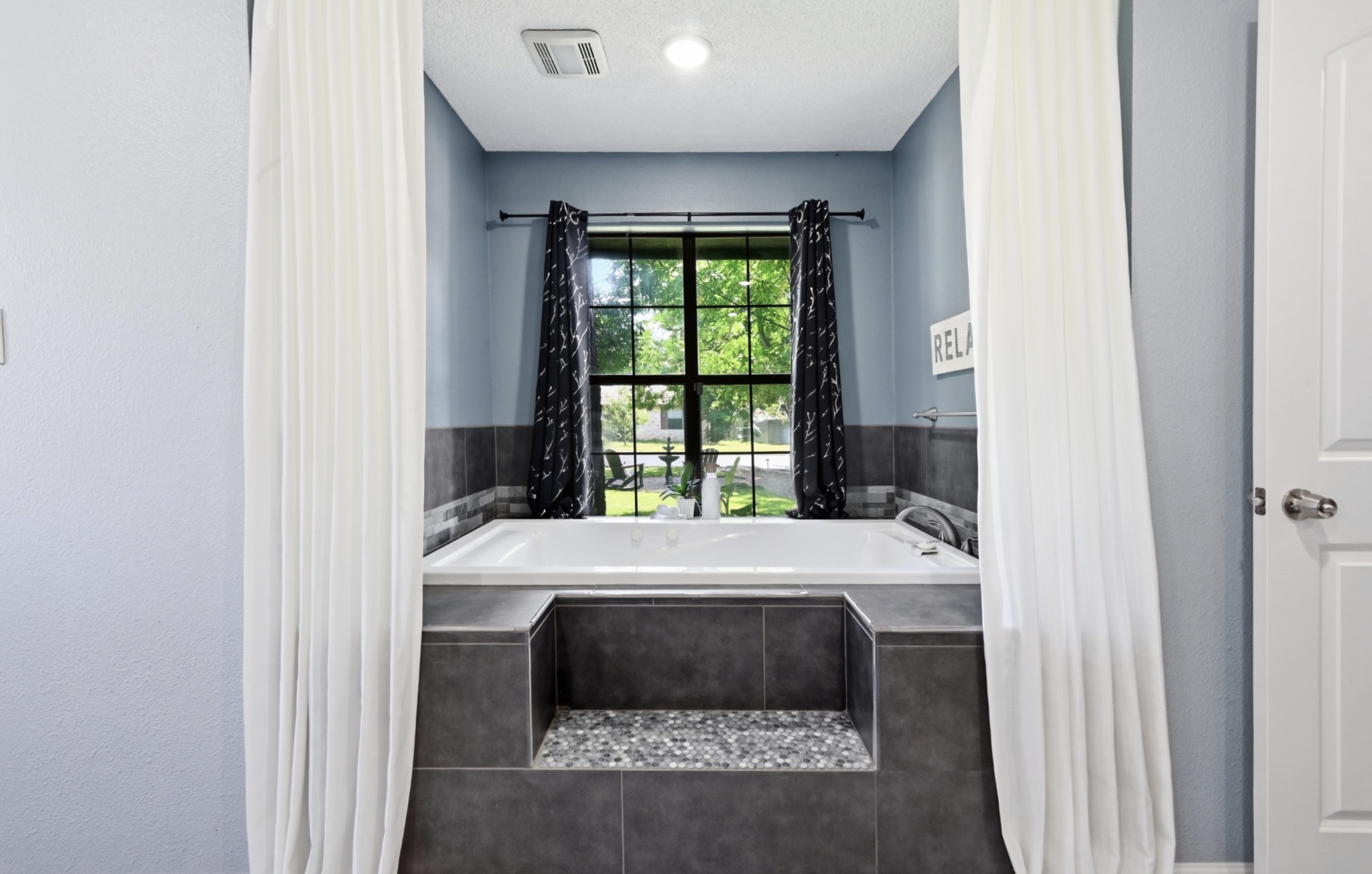 303 Pin Oak Drive Georgetown, TX 78628 - Photo 21 of 36 a bed sitting in a bedroom next to a window
