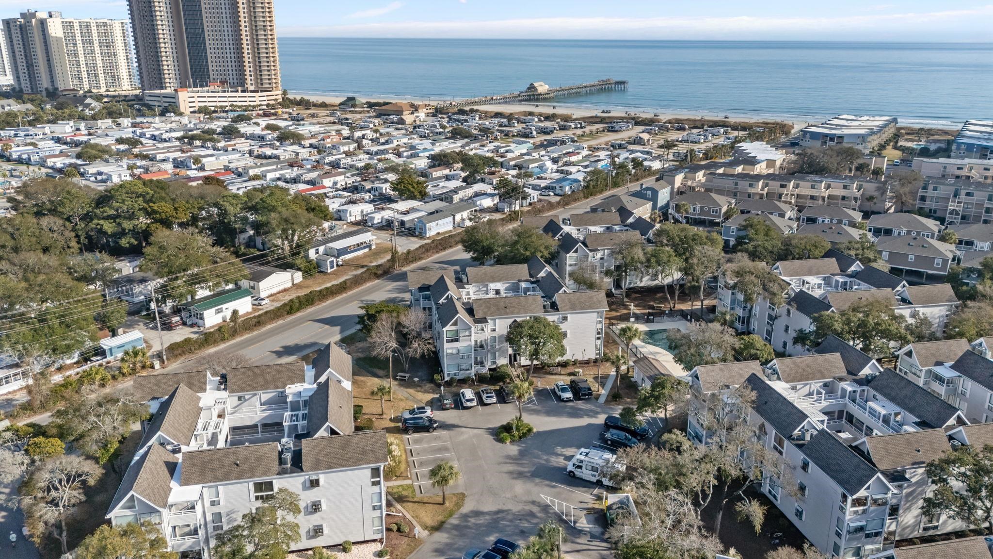 351 Lake Arrowhead Road, Unit 211 Myrtle Beach, SC 29572 - Photo 35 of 40 Aerial view of property's location with a nearby body of water and nearby suburban area