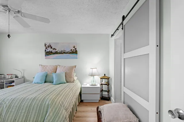 a bedroom with a bed and a walk in closet